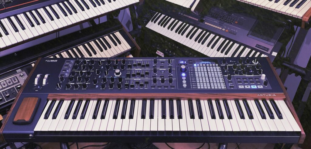 Photo of several vintage synthesizers.